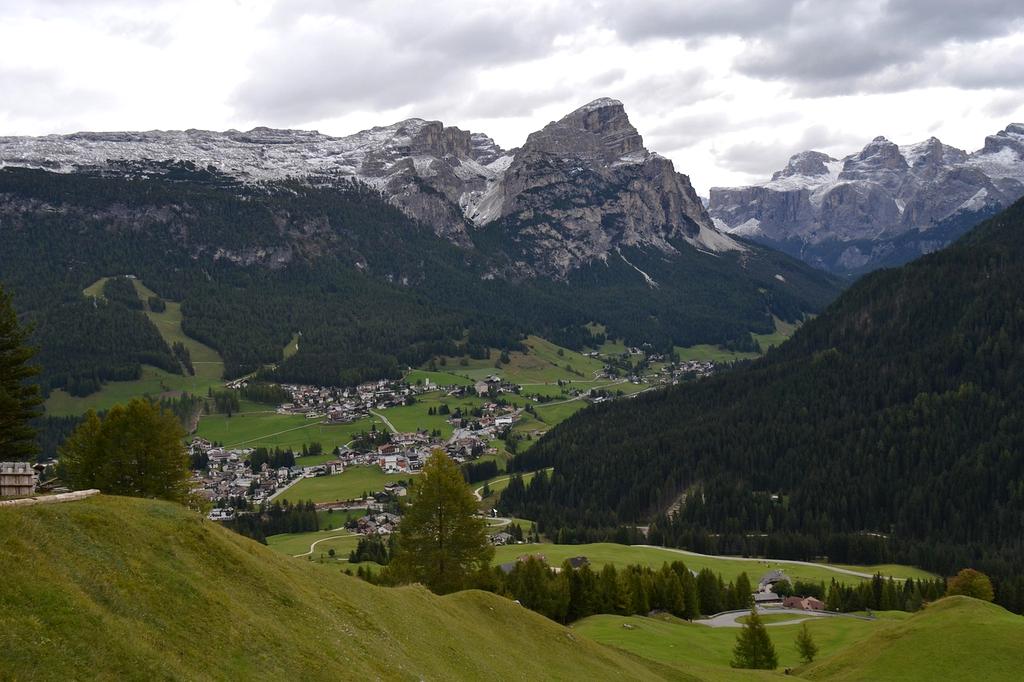 Backpacker with hiking poles on a mountain trail
